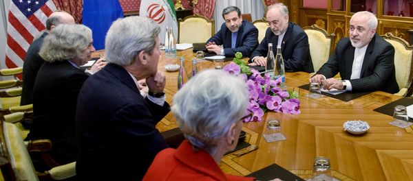 (From left) Robert Malley, of the US National Security Council, US Secretary of Energy Ernest Moniz, US Secretary of State John Kerry, US Under Secretary for Political Affairs Wendy Sherman, Iranian Deputy Foreign Minister Abbas Araghchi, Head of Iranian Atomic Energy Organisation Ali Akbar Salehi and Iranian Foreign Minister Javad Zarif wait for a meeting at the Beau Rivage Palace Hotel March 27, 2015 in Lausanne, Switzerland - Sputnik International