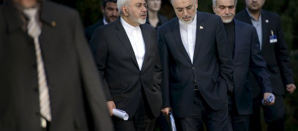 Iranian Foreign Minister Javad Zarif talks with Head of the Iranian Atomic Energy Organization Ali Akbar Salehi (C) after an afternoon meeting with U.S. Secretary of State John Kerry and U.S. officials at the Beau Rivage Palace Hotel in Lausanne March 27, 2015 Iranian Foreign Minister Javad Zarif talks with Head of the Iranian Atomic Energy Organization Ali Akbar Salehi (C) after an afternoon meeting with U.S. Secretary of State John Kerry and U.S. officials at the Beau Rivage Palace Hotel in Lausanne March 27, 2015 - Sputnik International