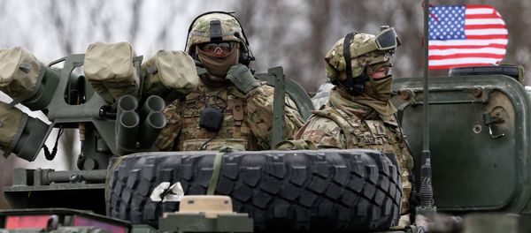 Members of US Army’s 2nd Cavalry Regiment ride on an armored vehicle during the ''Dragoon Ride'' military exercise in Salociai some 178 kms (110 miles) north of the capital Vilnius, Lithuania, Monday, March 23, 2015 - Sputnik International