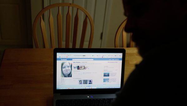 Chris Boston looks over a screen shot on his computer of the phony Facebook account that was set up in his daughter Alex's name Thursday, April 26, 2012, at their home in Acworth, Ga. Chris Boston looks over a screen shot on his computer of the phony Facebook account that was set up in his daughter Alex's name Thursday, April 26, 2012, at their home in Acworth, Ga. - Sputnik International