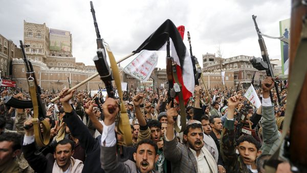 Shi'ite Muslim rebels hold up their weapons during a rally against air strikes in Sanaa March 26, 2015 Shi'ite Muslim rebels hold up their weapons during a rally against air strikes in Sanaa March 26, 2015 - Sputnik International
