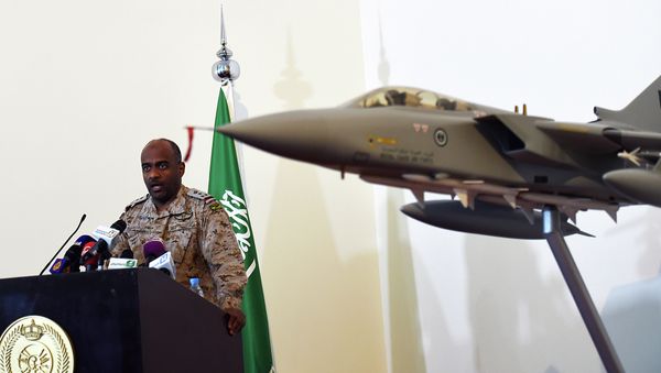 Saudi Brigadier General Ahmed Asiri, spokesman of the Saudi-led coalition forces, speaks to the media next to a replica of a Tornado fighter jet, at the Riyadh airbase in the Saudi capital on March 26, 2014 Saudi Brigadier General Ahmed Asiri, spokesman of the Saudi-led coalition forces, speaks to the media next to a replica of a Tornado fighter jet, at the Riyadh airbase in the Saudi capital on March 26, 2014 - Sputnik International