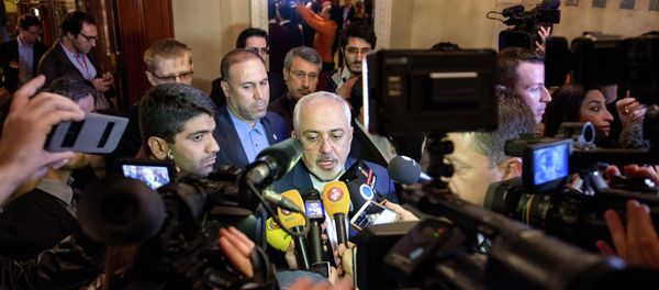 Iranian Foreign Minister Mohammad Javad Zarif (C) speaks to the press after meeting with the German and French foreign ministers in separate meetings at the Beau Rivage Palace Hotel in Lausanne on March 28, 2015 Iranian Foreign Minister Mohammad Javad Zarif (C) speaks to the press after meeting with the German and French foreign ministers in separate meetings at the Beau Rivage Palace Hotel in Lausanne on March 28, 2015 - Sputnik International