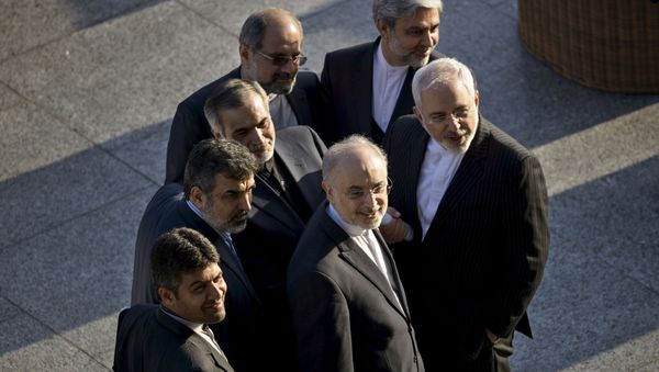Iranian Foreign Minister Javad Zarif (R) and Head of Iranian Atomic Energy Organization Ali Akbar Salehi stand with other members of their delegation while talking after a meeting with US Secretary of State John Kerry and US officials at the Beau Rivage Palace Hotel in Lausanne March 27, 2015 Iranian Foreign Minister Javad Zarif (R) and Head of Iranian Atomic Energy Organization Ali Akbar Salehi stand with other members of their delegation while talking after a meeting with US Secretary of State John Kerry and US officials at the Beau Rivage Palace Hotel in Lausanne March 27, 2015 - Sputnik International