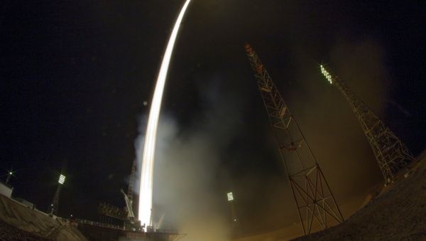 In this photo taken with a fisheye lens and with long time exposure the Soyuz-FG rocket booster with Soyuz TMA-16M space ship carrying a new crew to the International Space Station, ISS, blasts off at the Russian leased Baikonur cosmodrome, Kazakhstan, Saturday, March 28, 2015 In this photo taken with a fisheye lens and with long time exposure the Soyuz-FG rocket booster with Soyuz TMA-16M space ship carrying a new crew to the International Space Station, ISS, blasts off at the Russian leased Baikonur cosmodrome, Kazakhstan, Saturday, March 28, 2015 - Sputnik International