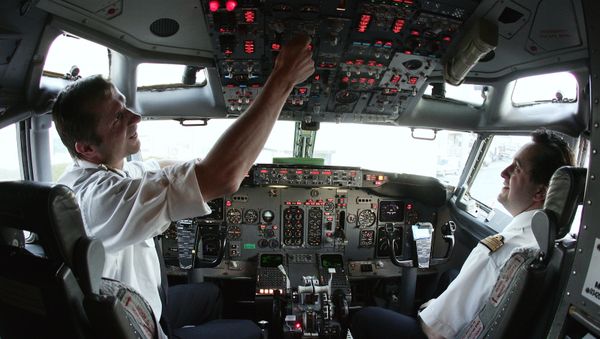 Europe Airpost Boeing B737-300 QC pilot (L) and co-pilot (R) make their pre flight check routine at Paris Roissy airport 21 March 2007 - Sputnik International