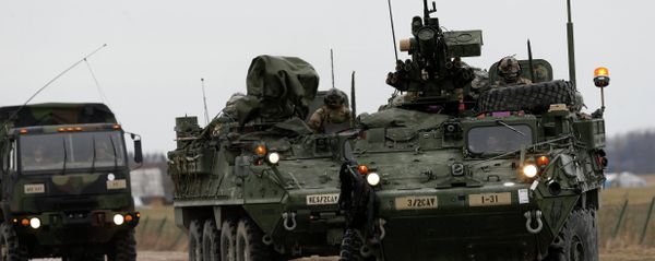 Stryker vehicles of the US Army’s 2nd Cavalry Regiment roll down the way during the ''Dragoon Ride'' military exercise in Salociai some 178 kms (110 miles) north of the capital Vilnius, Lithuania, Monday, March 23, 2015 - Sputnik International