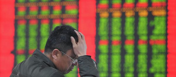 A stock investor gestures as he checks share prices at a securities firm in Fuyang, east China's Anhui province - Sputnik International