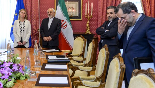 EU foreign policy chief Federica Mogherini (L) meets Iranian Foreign Minister Mohammad Javad Zarif (2nd-L) and Iranian Deputy Foreign Minister Abbas Araghchi (2nd-R) during Iranian nuclear talks in Lausanne on March 29, 2015 EU foreign policy chief Federica Mogherini (L) meets Iranian Foreign Minister Mohammad Javad Zarif (2nd-L) and Iranian Deputy Foreign Minister Abbas Araghchi (2nd-R) during Iranian nuclear talks in Lausanne on March 29, 2015 - Sputnik International