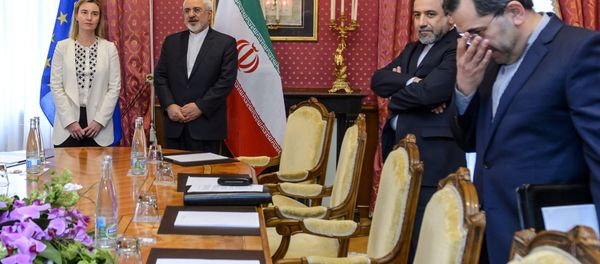 EU foreign policy chief Federica Mogherini (L) meets Iranian Foreign Minister Mohammad Javad Zarif (2nd-L) and Iranian Deputy Foreign Minister Abbas Araghchi (2nd-R) during Iranian nuclear talks in Lausanne on March 29, 2015 EU foreign policy chief Federica Mogherini (L) meets Iranian Foreign Minister Mohammad Javad Zarif (2nd-L) and Iranian Deputy Foreign Minister Abbas Araghchi (2nd-R) during Iranian nuclear talks in Lausanne on March 29, 2015 - Sputnik International