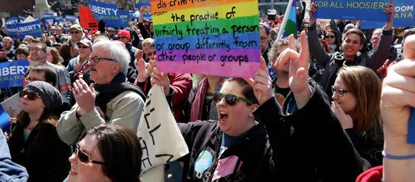 Demonstrators gather at Monument Circle to protest a controversial religious freedom bill recently signed by Governor Mike Pence during a rally in Indianapolis March 28, 2015 Demonstrators gather at Monument Circle to protest a controversial religious freedom bill recently signed by Governor Mike Pence during a rally in Indianapolis March 28, 2015 - Sputnik International
