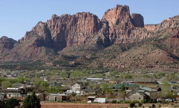 In this April 20, 2006, file photo, Hildale, Utah, sits at the base of Red Rock Cliff mountains with its sister city, Colorado City, Ariz., in the foreground In this April 20, 2006, file photo, Hildale, Utah, sits at the base of Red Rock Cliff mountains with its sister city, Colorado City, Ariz., in the foreground - Sputnik International