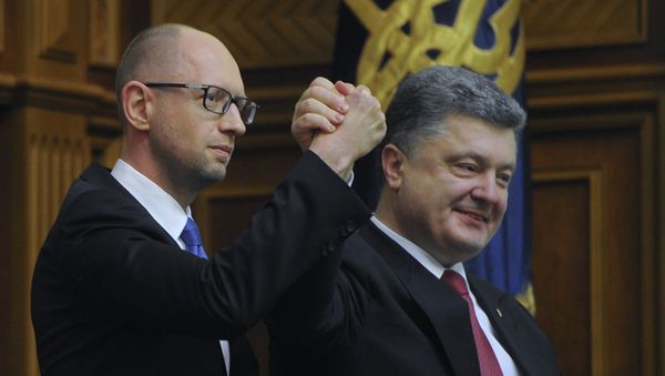 Ukraine's President Petro Poroshenko, right, celebrates with Arseniy Yatsenyuk after Yatsenyuk was appointed as Prime Minister during the opening first session of the Ukrainian parliament in Kiev Ukraine's President Petro Poroshenko, right, celebrates with Arseniy Yatsenyuk after Yatsenyuk was appointed as Prime Minister during the opening first session of the Ukrainian parliament in Kiev - Sputnik International