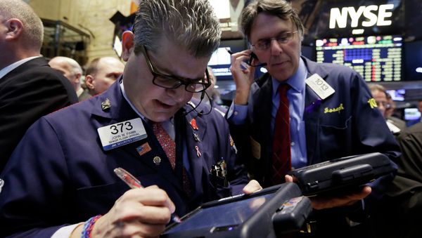 Trader John Panin, left, works on the floor of the New York Stock Exchange Trader John Panin, left, works on the floor of the New York Stock Exchange - Sputnik International