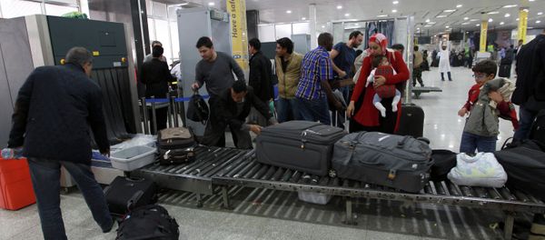 Travelers pass through security at Sanaa International Airport as hundreds of foreigners were evacuated from the Yemeni capital due to security reasons on March 28, 2015 Travelers pass through security at Sanaa International Airport as hundreds of foreigners were evacuated from the Yemeni capital due to security reasons on March 28, 2015 - Sputnik International