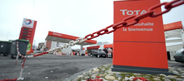 The closed entrance of an oil giant Total's filling station The closed entrance of an oil giant Total's filling station - Sputnik International