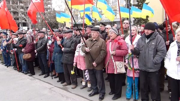 A rally in the southern Ukrainian city of Nikolaev commemorating the 71st anniversary of the freeing of the city from Nazi occupation became heated after a speech by a soldier in the Ukrainian armed forces prompted an angry outcry from residents. - Sputnik International