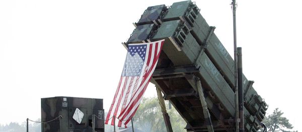 South Korean visitors shelter from the sun under the shadow of a U.S. Surface-to Air missile Patriot launcher during Air Power Day at the U.S. airbase in Osan, south of Seoul, South Korea - Sputnik International