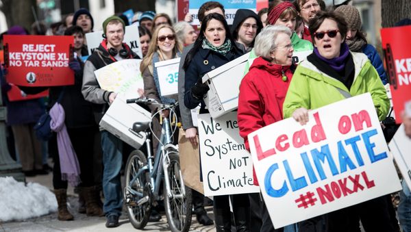 Activists march during a protest of the Keystone XL pipeline Activists march during a protest of the Keystone XL pipeline - Sputnik International