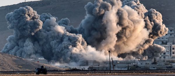 Smoke rises during airstrikes on the Syrian town of Ain al-Arab, known as Kobane by the Kurds Smoke rises during airstrikes on the Syrian town of Ain al-Arab, known as Kobane by the Kurds - Sputnik International