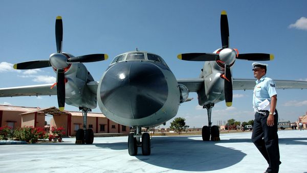 An Indian Air Force personnel walks past AN-32 aircraft - Sputnik International