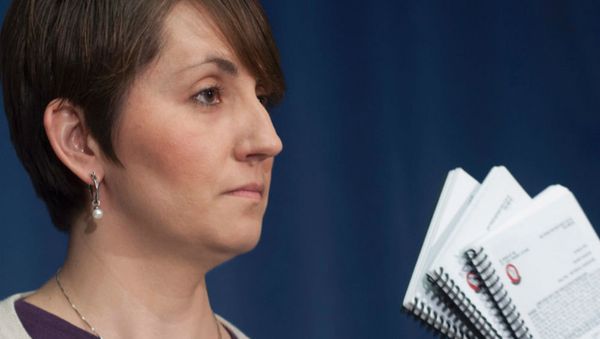 Jennifer Smith displays copies of the unofficial Air Force songbook as she speaks at a news conference in Washington, DC. Jennifer Smith displays copies of the unofficial Air Force songbook as she speaks at a news conference in Washington, DC. - Sputnik International