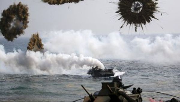 Amphibious assault vehicles of the South Korean Marine Corps throw smoke bombs as they move to land on shore during a U.S.-South Korea joint landing operation drill in Pohang Amphibious assault vehicles of the South Korean Marine Corps throw smoke bombs as they move to land on shore during a U.S.-South Korea joint landing operation drill in Pohang - Sputnik International
