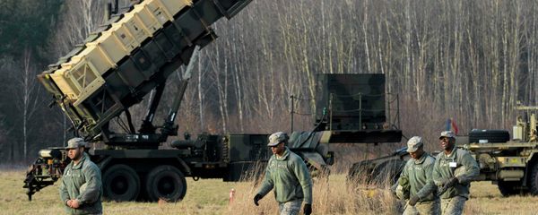 U.S soldiers walk next to a Patriot missile defence battery during join exercises at the military grouds in Sochaczew, near Warsaw U.S soldiers walk next to a Patriot missile defence battery during join exercises at the military grouds in Sochaczew, near Warsaw - Sputnik International