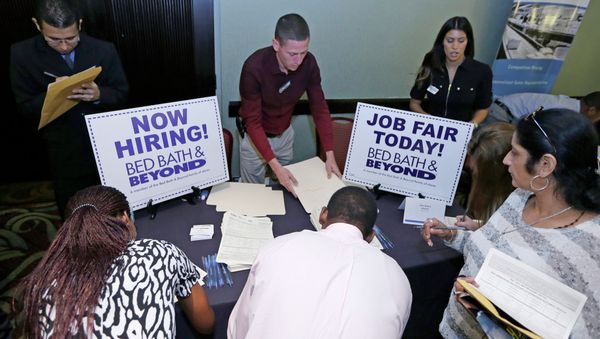 In this Oct. 22, 2014 file photo, job seekers fill out a job applications at a Bed Bath and Beyond table at a job fair in Miami Lakes, Fla. In this Oct. 22, 2014 file photo, job seekers fill out a job applications at a Bed Bath and Beyond table at a job fair in Miami Lakes, Fla. - Sputnik International