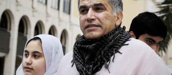 Bahraini human rights activist Nabeel Rajab (C) and his daughter Malak (L) leave a court building after attending his appeal hearing on February 11, 2015 in the capital Manama - Sputnik International