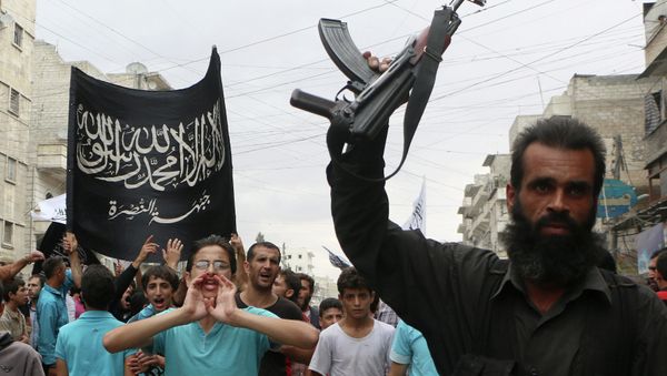 Supporters of the Al Nusra Front take part in a protest against Syrian President Bashar al-Assad and the international coalition in Aleppo on September 26, 2014 Supporters of the Al Nusra Front take part in a protest against Syrian President Bashar al-Assad and the international coalition in Aleppo on September 26, 2014 - Sputnik International
