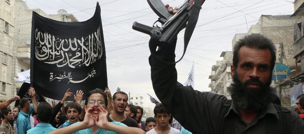 Supporters of the Al Nusra Front take part in a protest against Syrian President Bashar al-Assad and the international coalition in Aleppo on September 26, 2014 Supporters of the Al Nusra Front take part in a protest against Syrian President Bashar al-Assad and the international coalition in Aleppo on September 26, 2014 - Sputnik International