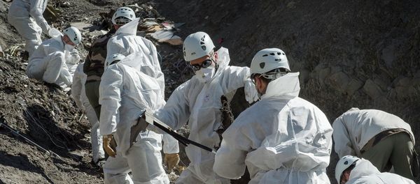 Rescue workers and investigators, seen in this picture made available to the media by the French Interior Ministry April 3, 2015, work at the crash site of a Germanwings Airbus A320, near Seyne-les-Alpes Rescue workers and investigators, seen in this picture made available to the media by the French Interior Ministry April 3, 2015, work at the crash site of a Germanwings Airbus A320, near Seyne-les-Alpes - Sputnik International