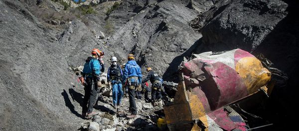 Rescue workers and investigators, seen in this picture made available to the media by the French Interior Ministry April 1, 2015, work near debris from wreckage at the crash site of a Germanwings Airbus A320, near Seyne-les-Alpes. Rescue workers and investigators, seen in this picture made available to the media by the French Interior Ministry April 1, 2015, work near debris from wreckage at the crash site of a Germanwings Airbus A320, near Seyne-les-Alpes. - Sputnik International