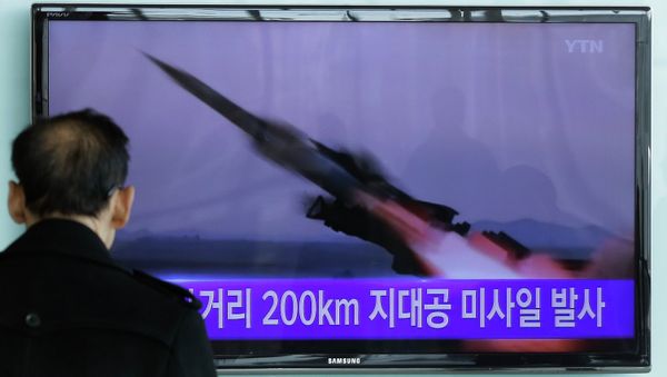 A South Korean man watches a TV news program showing the file footage of the missile launch conducted by North Korea. A South Korean man watches a TV news program showing the file footage of the missile launch conducted by North Korea. - Sputnik International