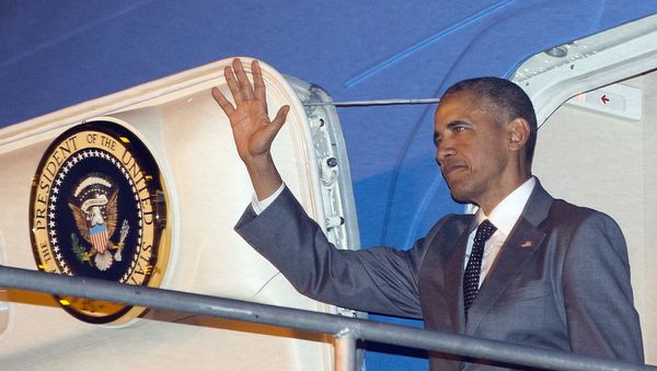 U.S. President Barack Obama waves during his arrival on Air Force One Thursday, April 9, 2015, at Tocumen International Airport in Panama City, Panama. - Sputnik International