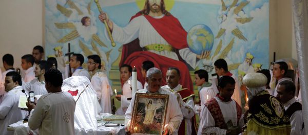 Egyptian Coptic Christians pray during the Easter Eve service at St. Sama'ans Church in the Mokattam district of Cairo, Egypt Egyptian Coptic Christians pray during the Easter Eve service at St. Sama'ans Church in the Mokattam district of Cairo, Egypt - Sputnik International