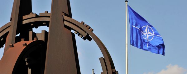 A picture taken on March 2, 2014 shows the NATO flag in the wind at the NATO headquarters in Brussels. A picture taken on March 2, 2014 shows the NATO flag in the wind at the NATO headquarters in Brussels. - Sputnik International