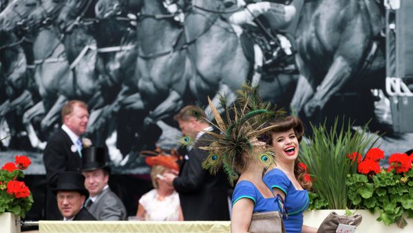 Two members of a choral group laugh as they walk near the parade ring on the third day of the Royal Ascot horse racing meeting, which is traditionally known as Ladies Day, at Ascot, England, Thursday, June, 19, 2014 Two members of a choral group laugh as they walk near the parade ring on the third day of the Royal Ascot horse racing meeting, which is traditionally known as Ladies Day, at Ascot, England, Thursday, June, 19, 2014 - Sputnik International