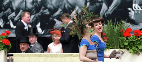 Two members of a choral group laugh as they walk near the parade ring on the third day of the Royal Ascot horse racing meeting, which is traditionally known as Ladies Day, at Ascot, England, Thursday, June, 19, 2014 Two members of a choral group laugh as they walk near the parade ring on the third day of the Royal Ascot horse racing meeting, which is traditionally known as Ladies Day, at Ascot, England, Thursday, June, 19, 2014 - Sputnik International