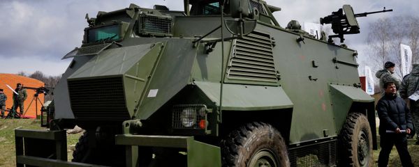 A Ukrainian weapons system installed on a British Saxon military armored personnel carrier during a presentation of new samples of Ukrainian-made weapons for the Ukrainian Army at a military base in Novi Petrivtsi outside Kiev, Ukraine, Saturday, April 4, 2015 - Sputnik International