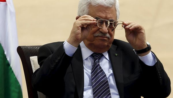 Palestinian President Mahmoud Abbas adjusts his glasses as he attends the opening ceremony of a park in the West Bank city of Ramallah April 5, 2015 Palestinian President Mahmoud Abbas adjusts his glasses as he attends the opening ceremony of a park in the West Bank city of Ramallah April 5, 2015 - Sputnik International
