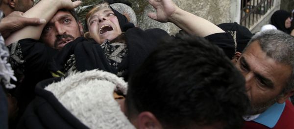 Mourners grieve during the funeral of Ziyad Awad during his funeral in Beit Ummar, West Bank, Friday, April 10, 2015 Mourners grieve during the funeral of Ziyad Awad during his funeral in Beit Ummar, West Bank, Friday, April 10, 2015 - Sputnik International
