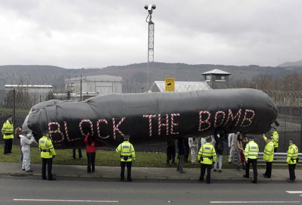 Campaigners hold an inflatable during a protest in front of the Trident submarine fleet naval base in Faslane, Scotland Campaigners hold an inflatable during a protest in front of the Trident submarine fleet naval base in Faslane, Scotland - Sputnik International