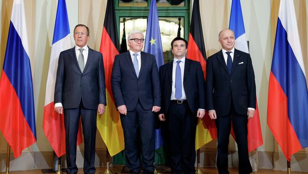 German Foreign Minister Frank-Walter Steinmeier, second left, welcomes his counterparts from France, Laurent Fabius, right, Russia, Sergey Lavrov, left, and Ukraine, Pavlo Klimkin, second right, for a meeting on the situation in Ukraine in Berlin, Germany, Monday, Jan. 12, 2015. German Foreign Minister Frank-Walter Steinmeier, second left, welcomes his counterparts from France, Laurent Fabius, right, Russia, Sergey Lavrov, left, and Ukraine, Pavlo Klimkin, second right, for a meeting on the situation in Ukraine in Berlin, Germany, Monday, Jan. 12, 2015. - Sputnik International