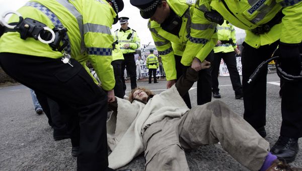 Campaigners stage a protest in front of the Trident submarine fleet naval base in Faslane, Scotland Campaigners stage a protest in front of the Trident submarine fleet naval base in Faslane, Scotland - Sputnik International