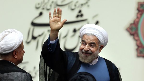 Iran's new President Hasan Rouhani, waves after swearing in at the parliament, in Tehran, Iran Iran's new President Hasan Rouhani, waves after swearing in at the parliament, in Tehran, Iran - Sputnik International