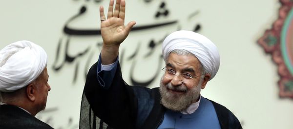 Iran's new President Hasan Rouhani, waves after swearing in at the parliament, in Tehran, Iran Iran's new President Hasan Rouhani, waves after swearing in at the parliament, in Tehran, Iran - Sputnik International