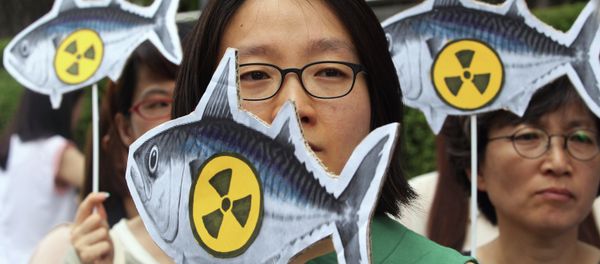 Environmentalists stage a rally denouncing imported agricultural and marine products from Japan without radioactivity test in front of the Japanese Embassy in Seoul, South Korea, Thursday, Aug. 1, 2013 - Sputnik International