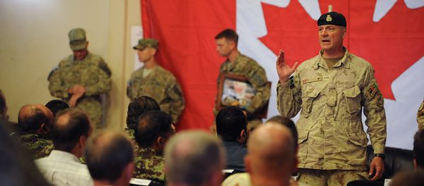 Brigadier General Dean Milner, Commander of Canadian forces in Afghanistan, speaks with soldiers after a handover ceremony to US forces at Kandahar airbase Brigadier General Dean Milner, Commander of Canadian forces in Afghanistan, speaks with soldiers after a handover ceremony to US forces at Kandahar airbase - Sputnik International